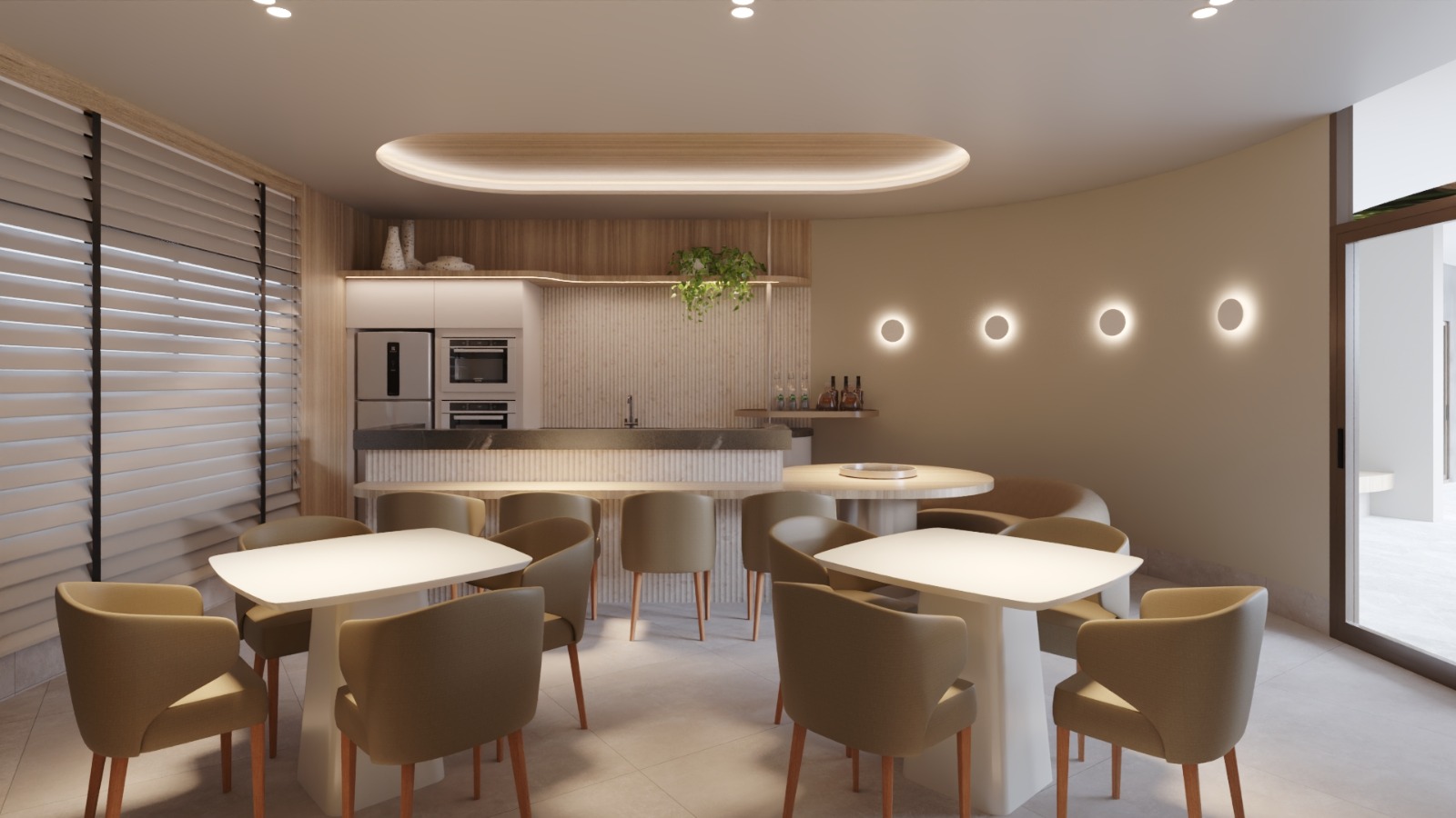 Espaço gourmet com cozinha integrada e mesas de refeição